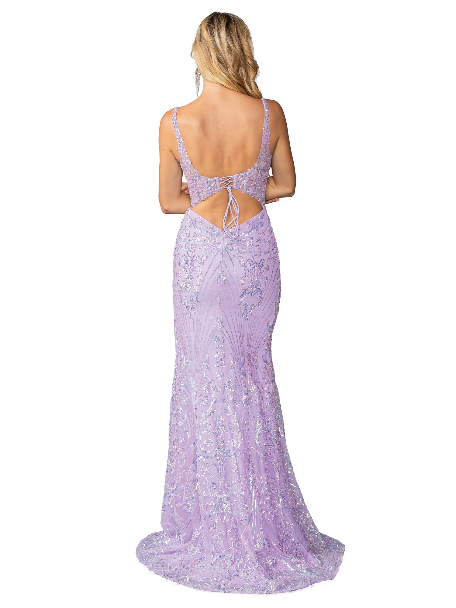 A woman faces away, wearing the Dancing Queen 4461 long sequin-print prom dress in lavender with a strappy back, low cut, and waist tie detail.